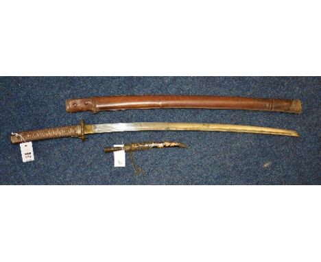 A Japanese Katana sword, with foliate metal grip, curved blade and leather scabbard, blade 70cm long, also with Eastern dagge