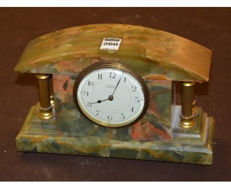 An onyx Corinthian style mantel clock, named JW Cassidy, Worcester to enamel dial, 17cm high x 26cm wide