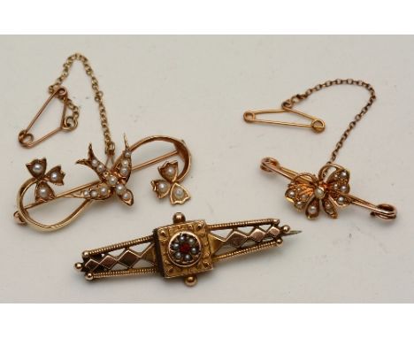 A 9ct gold seed pearl swallow brooch, 3.7g, together with a 9ct gold ruby and seed pearl mourning brooch, 2.7g, both stamped 