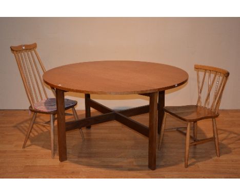 A drop leaf dining table, with six blonde Ercol chairs, table 73cm high x 130cm long x 132cm wide, chairs 78 & 96cm high