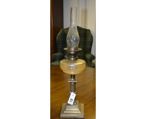 An early 20th century brass oil lamp, with cut glass bowl on top of Corinthian column support and square stepped base, 67cm h