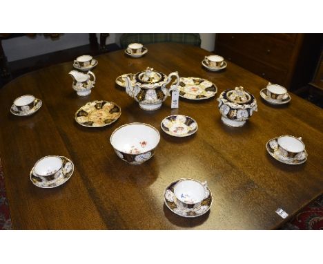 A Victorian Rockingham style tea set, with navy and gilt decoration on white ground, comprising teapot, milk, jug sucrier, bo