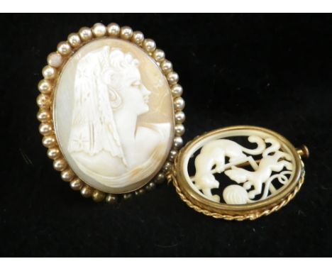 An oval shell cameo portrait of a veiled woman with faux pearl border and a French resin and gilt brooch (2)