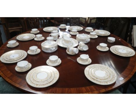 A Royal Worcester 'Hyde Park' dinner service, decorated with gilt (retaining original packaging bags)