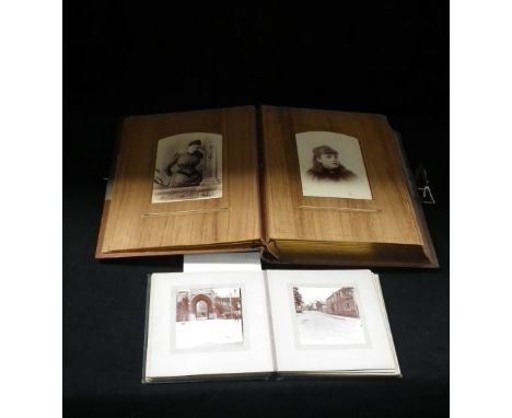 A vintage Kodak photograph album and another photograph album between wooden boards
