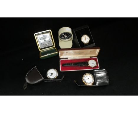 Four cased vintage travelling clocks and two gold plated Rotary and Accurist wristwatches