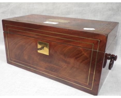 An early 19th century mahogany and brass inlaid tea caddy with turned ring handles, the lid lined with red leather over remov