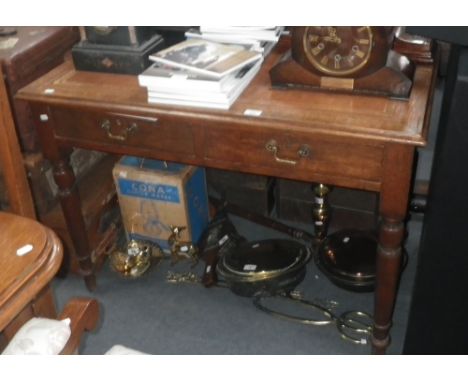 An Edwardian light oak writing table with inset tan leather tooled top 42" wide