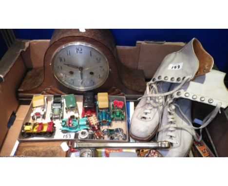 A quantity of assorted toys, a mantel clock, vintage ice-skates and other items