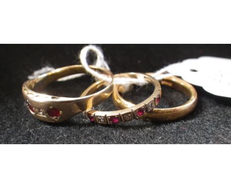 A 22ct yellow gold wedding band, a 9ct yellow gold ruby and white stone half-eternity band and a ruby and diamond gypsy ring 