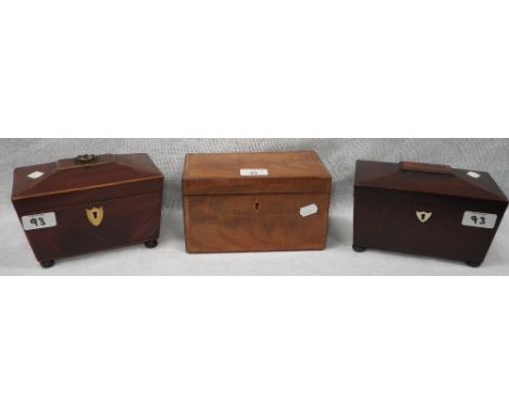 A Regency mahogany sarcophagus-shaped tea caddy, another similar and a crossbanded caddy (3)