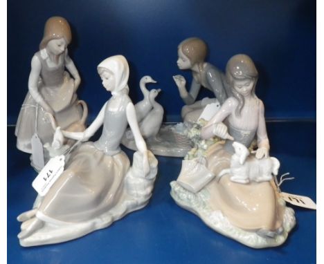 A Lladro figure of a woman seated by a bird and three similar figures