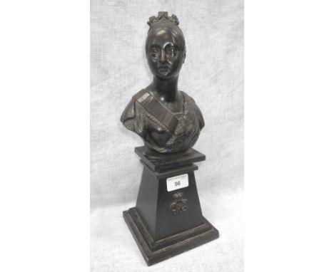 A cast-iron portrait bust of Queen Victoria on a tapering stepped base with case cipher, 14" high