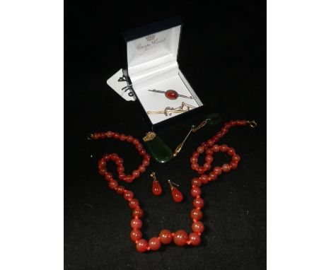 A 'jade' pendant with 9ct yellow gold engraved mount and a collection of other 'jade' and hardstone jewellery items