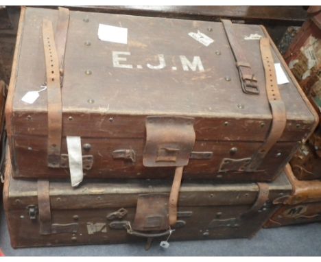 A canvas travelling trunk with leather trim and another similar