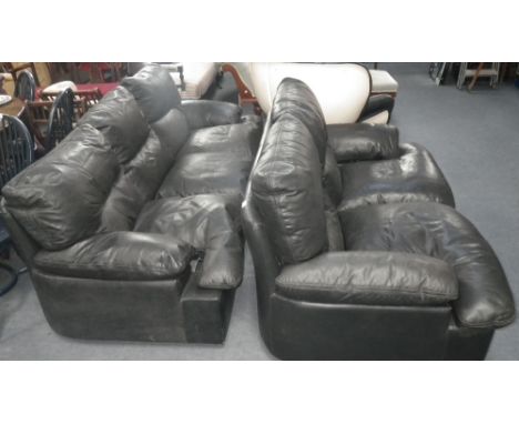 Collet & Palmer: A three seater black leather sofa and a matching two seater sofa