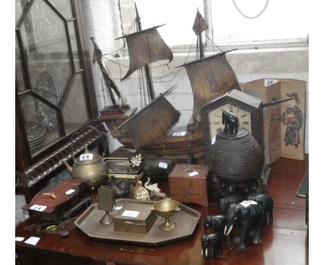 A Victorian mantel clock, a carved coconut shell decorated with elephants, an owl wall clock with moving eyes and similar ite