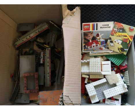 Box containing Tri-ang model railway 4008 engine with track and other parts, together with a box of Lego Shell Garage parts. 