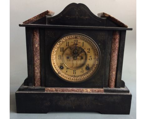 A black slate classical temple style mantel clock with mottled red marble detail and brass face, height 30cm. IMPORTANT: Onli