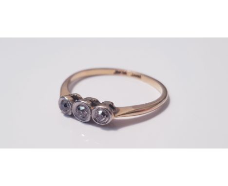 A18ct yellow gold and platinum three stone diamond ring rub over setting, ring size M, approx. weight 2.0gms. IMPORTANT: Onli