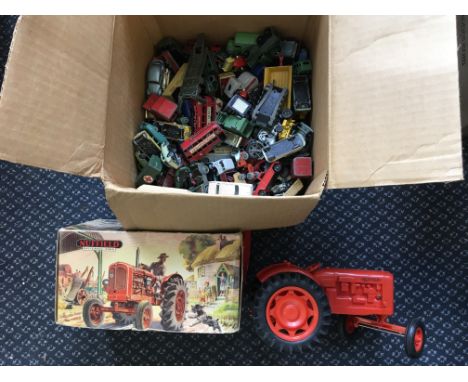 A boxed Nuffield Universal model tractor with a box containing various Matchbox model vehicles. IMPORTANT: Online viewing and