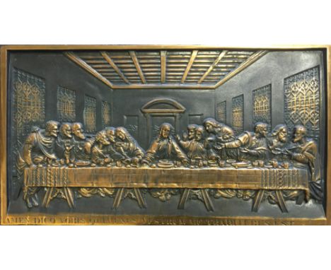 A bronze plaque depicting the Last Supper, with Latin inscription to base, ‘I tell you, one of you will betray’, 36.5cm x 65.