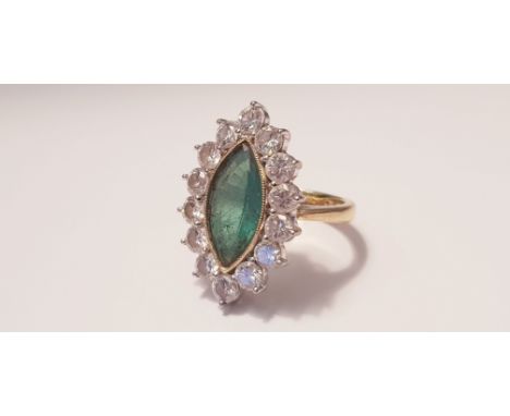 A yellow gold marked 750, Marquise emerald and diamond cluster ring, 14 diamonds surrounding emerald, each diamond approx. 0.