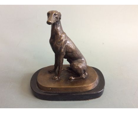 Bronze sculpture of a greyhound mounted on marble, height 20cm. IMPORTANT: Online viewing and bidding only. No in person coll