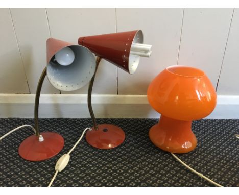 Two red angle lamps with an orange glass shade desk lamp. IMPORTANT: Online viewing and bidding only. No in person collection