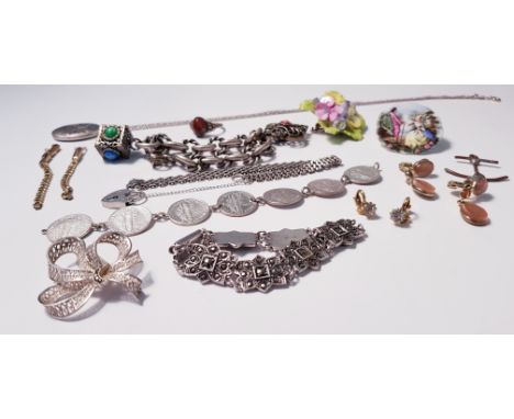 A collection of jewellery to include a silver gate bracelet, hallmark on padlock, a bracelet of seven various coins, an oval 