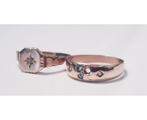 A rose coloured metal ring with gem stones ( one stone missing), ring size M, approx. weight 0.68gms., together with a rose c