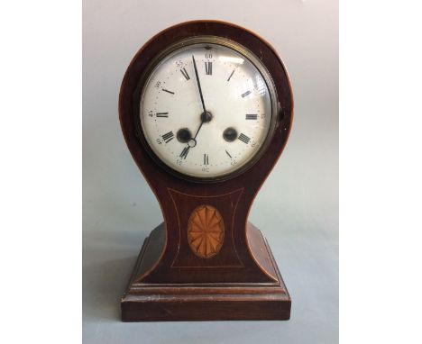 A mahogany balloon cased mantel clock with wooden inlay design and border, height 27cm. IMPORTANT: Online viewing and bidding