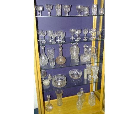 A quantity of crystal wares, to include seven decanters, vases, jugs, tumblers, wine glasses, pair of Stuart Crystal champagn