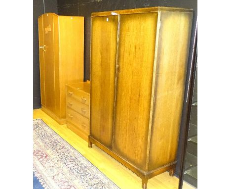 A vintage oak three piece bedroom suite, comprising of wardrobe, dressing chest and chest of drawers, wardrobe 188cm high x 9