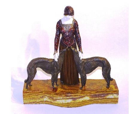 An Art Deco cold painted bronze figure group after Demetre H Chiparus, in the form of a female in full length dress flanked o