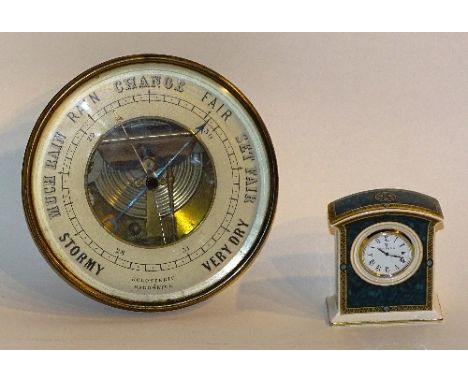 A brass holosteric barometer, 16.5cm diameter, together with a boxed Royal Doulton 'Biltmore' clock decorated in green and gi