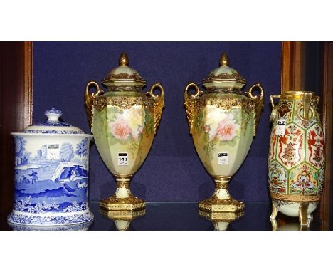 A pair of Noritake urns, decorated with panels of roses and gilt edging, 35cm high, together with a Noritake vase decorated w