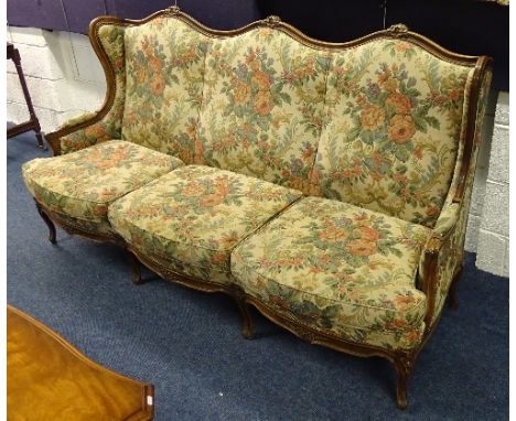A French three seater sofa, upholstered in floral fabric, 103cm high x 187cm wide