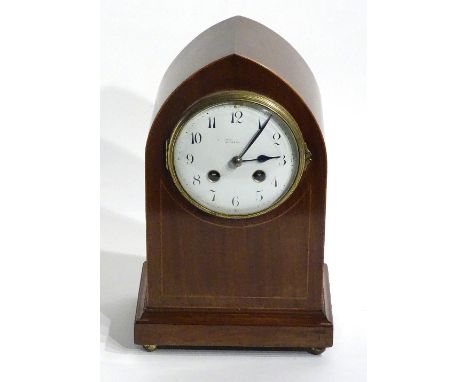 An Edwardian mahogany lancet form mantel clock by J Cameron & Son, Kilmarnock, the white enamel dial with Arabic numerals, wi