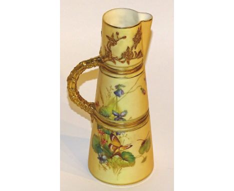 A late 19th century Royal Worcester blush ivory jug, decorated with a panel of butterfly in foliage, with gilt flowers and ha