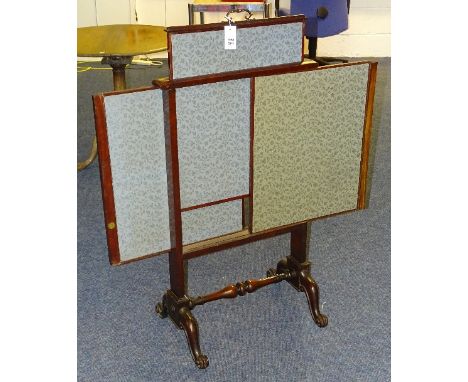 A Victorian mahogany firescreen, with pull up and sliding fabric covered sections, raised on scroll supports, 113cm high