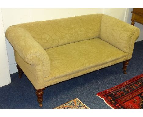 A late Victorian sofa, upholstered in later cream velour, raised on mahogany turned supports, 65cm high x 152cm wide