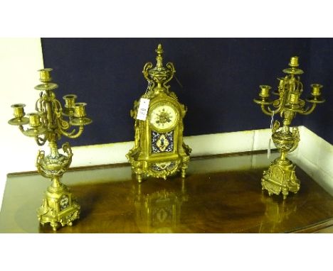 A reproduction French gilt metal and champleve enamel clock garniture, the clock with white enamel chapter ring bearing Roman