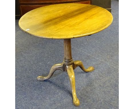 A George III mahogany tripod table, the circular top with snap and bird cage action, terminating on pad foot, 70cm high x 80c