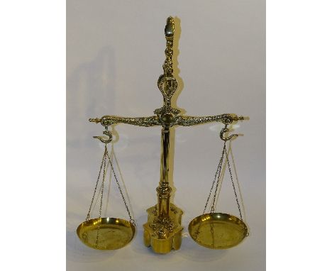 A brass set of shop scales with weights, decorated with serpents to hanging mechanism, 60cm high x 46cm wide