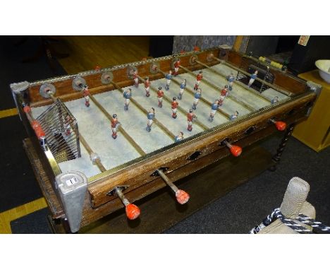 A vintage French table top wooden foosball/football table circa 1940's, 20cm high x 151cm long x 86cm wide