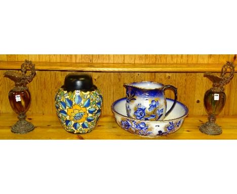 A large Brentleigh Ware jar with cover, decorated with stylized yellow flowers with blue leaves on cream and black ground, 30