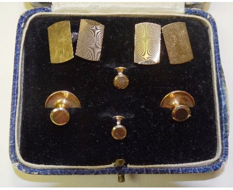A boxed set of 9ct gold cufflinks and studs, the cufflinks with engine turned decoration, all stamped 9ct, in WM Mossman Gold