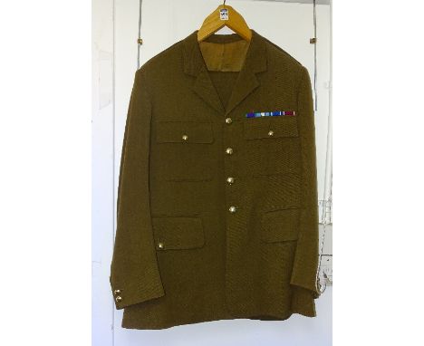 A Light Dragoons Officers service dress, comprising jacket and trousers in khaki colour with ribbon colours above jacket pock