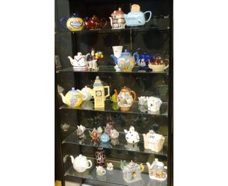 A large collection of novelty teapots, to include glass and ceramic examples, together with a Leonardo collection Balloon Sel